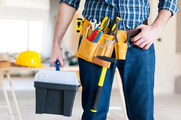 a man wearing a tool belt